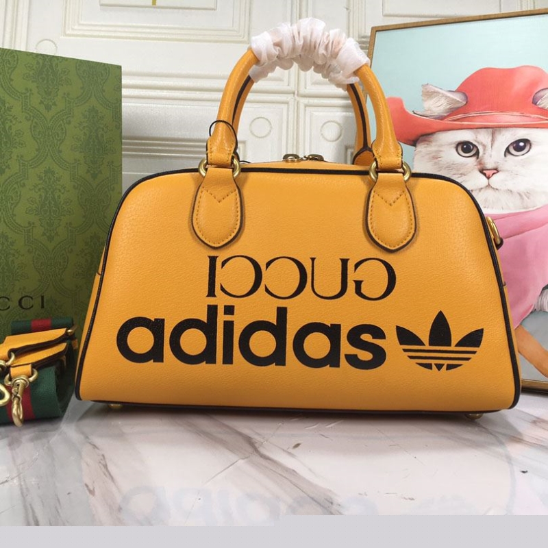 G*u*i top handle bags